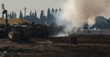 An Israeli soldier sits on top of a tank at a camp near the Israel-Gaza border, Jan. 12, 2025. (Reuters Photo)