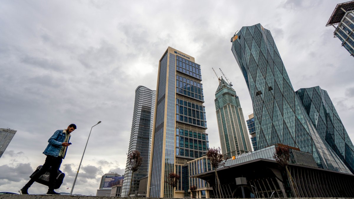 A pedestrian passes by the Istanbul Financial Center (IFC), Istanbul, Türkiye, May 9, 2023. (Getty Images Photo)