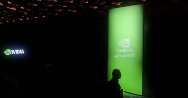 A man walks past the Nvidia logo at the company's AI Summit in Mumbai, India, Oct. 24, 2024. (Reuters Photo)
