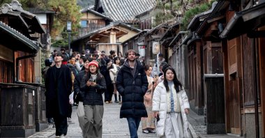 Tourists walk down a street near Yasaka Pagoda during a visit to the city of Kyoto, Japan, Jan. 13, 2025. (AFP Photo)