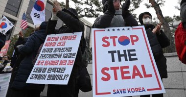 Supporters of impeached South Korean president Yoon Suk Yeol hold placards reading "Stop the steal" in front of the Constitutional Court, Seoul, South Korea, Jan. 14, 2025. (AFP Photo)