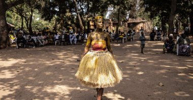 A Kokou initiate, a warrior god in the traditional religion of Benin, walks in the sacred forest during the first day of the Voodoo Festival in Ouidah, Benin, Jan. 9, 2025 . (AFP Photo)
