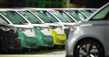 New VW ID Buzz vehicles, fully electric-driven microbus from Volkswagen Commercial Vehicles, are seen parked next to the commercial vehicle plant of Volkswagen, Hanover, Germany, Dec. 19, 2024. (AFP Photo)