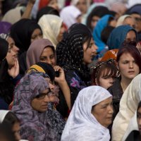 Muslim women attend an open-air funeral service in Summerfield Park, Birmingham, England, Aug. 18, 2011. (AP File Photo)