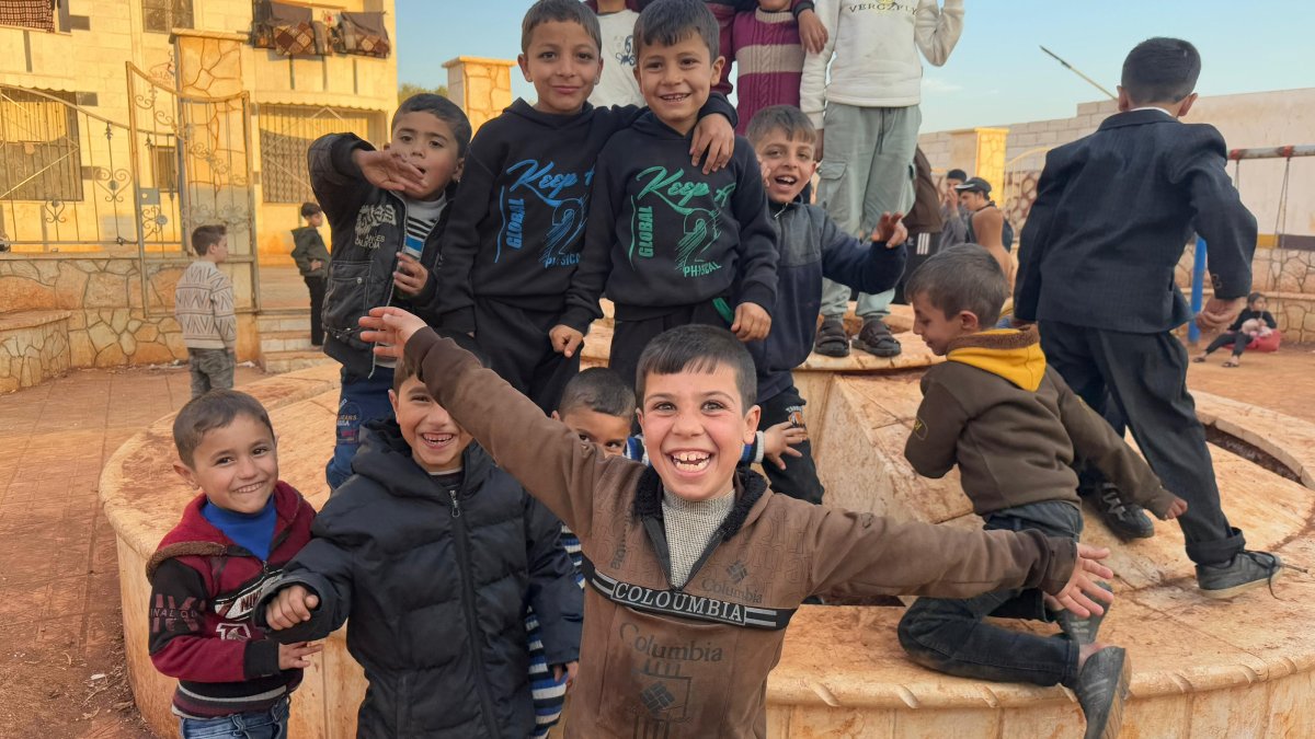 Children smile for a photo taken at an orphanage of the Türkiye Diyanet Foundation (TDV), Idlib, Syria, Jan. 15, 2025. (AA Photo)