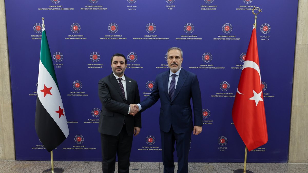 Foreign Minister Hakan Fidan and Syrian Foreign Minister Asaad Hassan al-Shaibani posing for a photo during their meeting in Ankara, Jan. 15, 2025.  (EPA via Foreign Ministry)