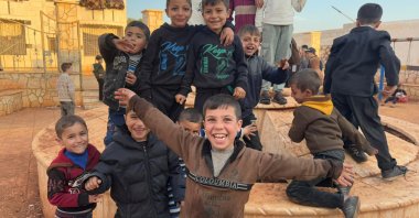 Children smile for a photo taken at an orphanage of the Türkiye Diyanet Foundation (TDV), Idlib, Syria, Jan. 15, 2025. (AA Photo)