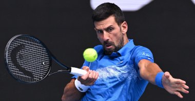 Serbia&#039;s Novak Djokovic hits a return against Portugal&#039;s Jaime Faria during their Australian Open match in Melbourne, Australia, Jan. 15, 2025. (AFP Photo)