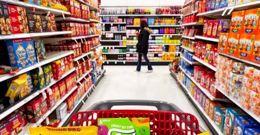 Bazooka Ring Pop Lollipops, Del Monte Fruit Cup Snacks, Starburst Fruit By The Foot snacks, Double Bubble Bubble gum, Vigo Saffron Yellow Rice, and Baby Bottle Pop candy, all products that use Red Dye # 3, can be seen in this illustration photograph, Dec. 27, 2024. (AFP Photo)