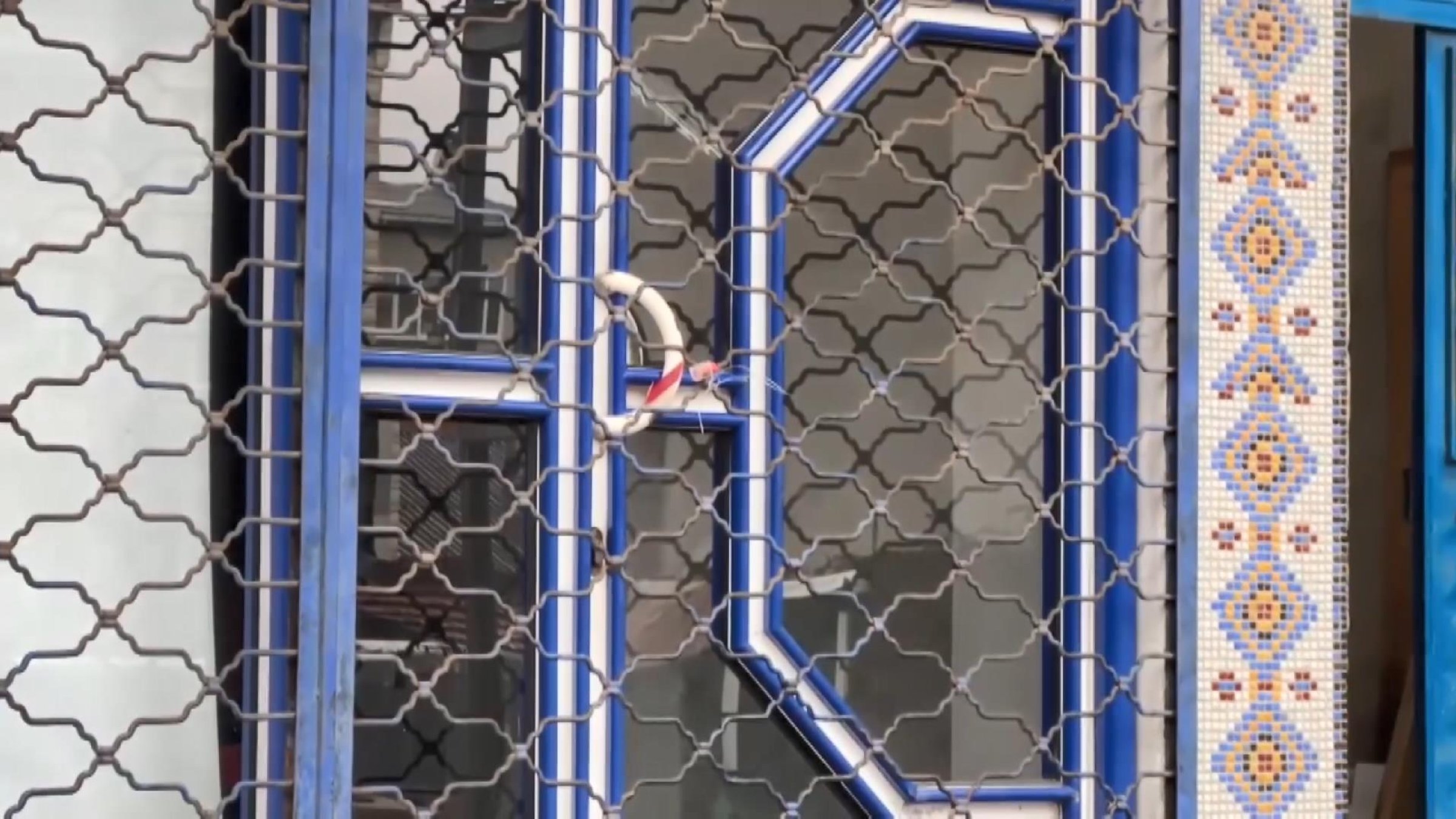 A seal placed by authorities secures a door after a venue was shut down for producing counterfeit alcohol, Istanbul, Türkiye, Jan. 16, 2025. (DHA Photo)