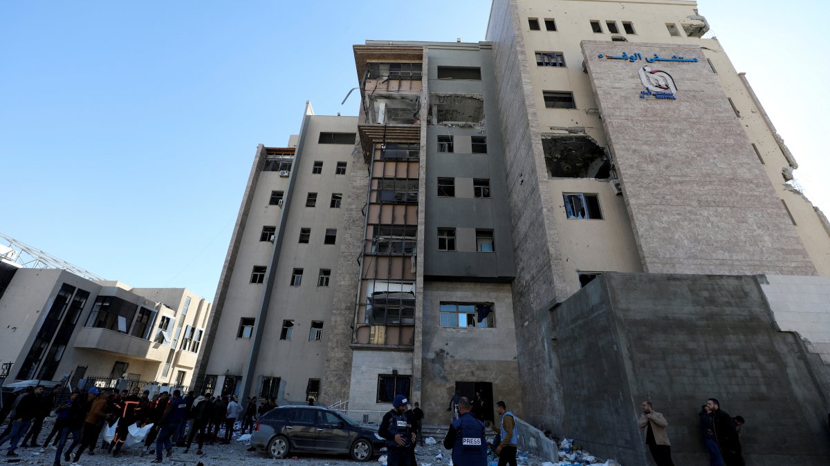 Palestinians inspect the site of an Israeli strike on Al-Wafaa hospital in Gaza City, Palestine, Dec. 29, 2024. (Reuters Photo)