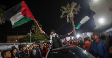 Palestinians react to news of a cease-fire agreement with Israel, in Deir al-Balah, central Gaza Strip, Palestine, Jan. 15, 2025.  (EPA Photo)
