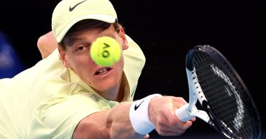 Italy&#039;s Jannik Sinner hits a return against Australia’s Tristan Schoolkate during their men&#039;s singles match on day five of the Australian Open tennis tournament in Melbourne on January 16, 2025. (AFP Photo)