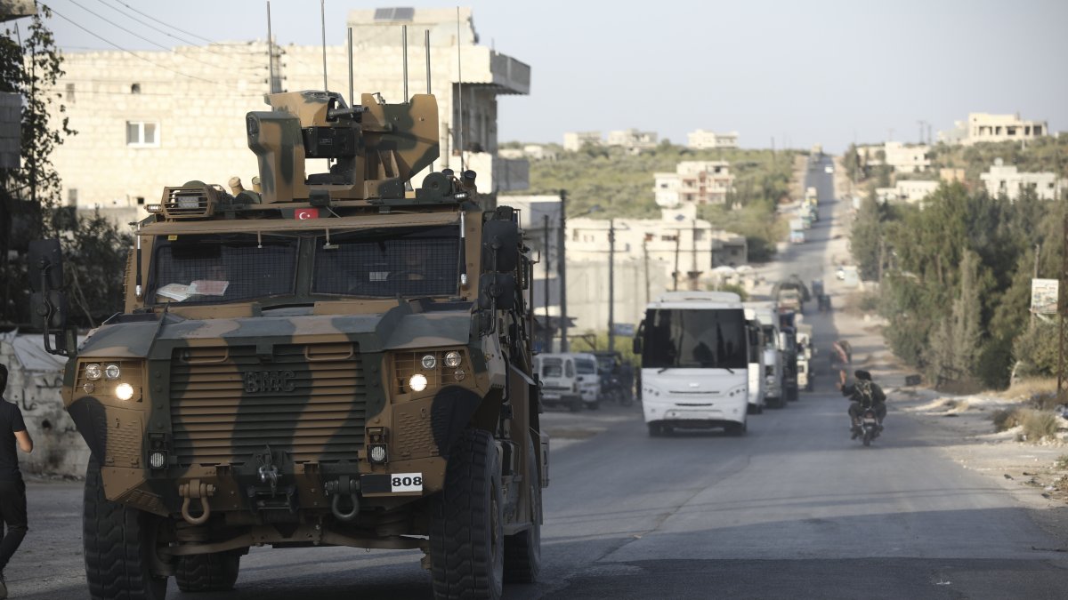 A Turkish military convoy drives through the village of Urum al-Jawz, Idlib, Syria, Oct. 20, 2020. (AP Photo)