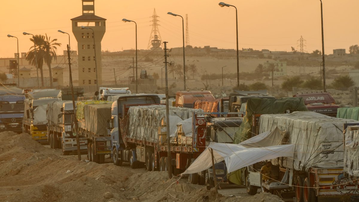 Trucks of humanitarian aids wait to cross the Rafah border crossing between Egypt and the Gaza Strip, in Rafah, Egypt, Monday, Sept. 9, 2024. (AP File Photo)