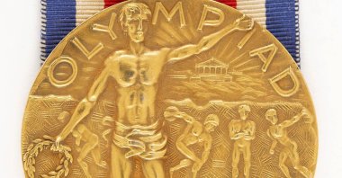 This November 2024 image provided by RR Auction shows a rare gold medal from the 1904 Olympics at the intake office of RR Auction, in Amherst, N.H., U.S. (AP Photo)
