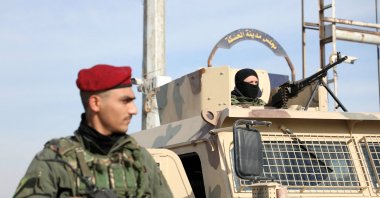 A member of the PKK/YPG terrorist group stands near a street after anti-regime forces seized the capital and ousted Bashar Assad, Hassakeh, Syria, Dec. 11, 2024. (Reuters Photo)