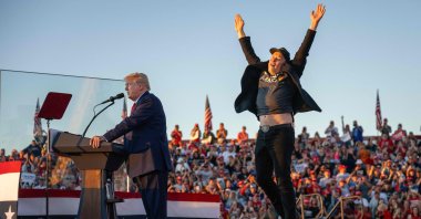 Tesla CEO Elon Musk (R) jumps on stage as he joins former U.S. President and Republican presidential candidate Donald Trump during a campaign rally at the site of his first assassination attempt in Butler, Pennsylvania, U.S., Oct. 5, 2024. (AFP Photo)