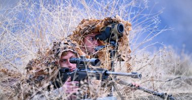 Two Turkish gendarmerie sharpshooters guard the Iraqi border in eastern Hakkari province, Türkiye, Dec. 16, 2024. (AA Photo)