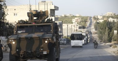 A Turkish military convoy drives through the village of Urum al-Jawz, Idlib, Syria, Oct. 20, 2020. (AP Photo)