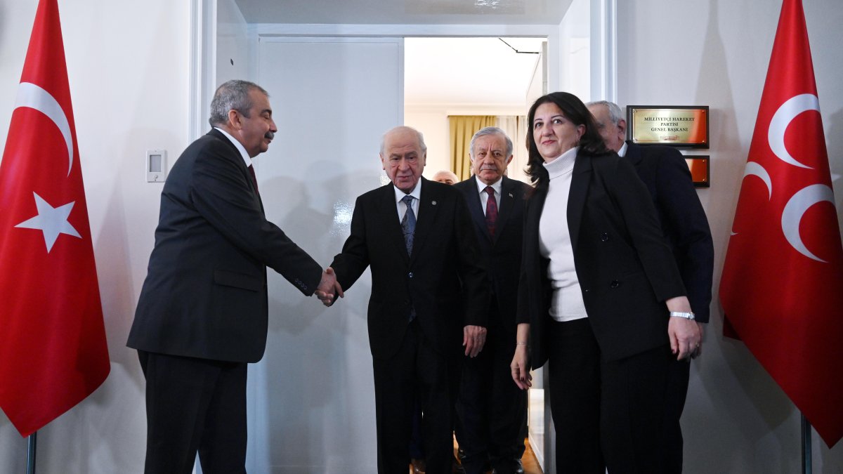 Peoples’ Equality and Democracy Party (DEM Party) lawmakers shake hands with Devlet Bahçeli (C), architect of the terror-free Türkiye initiative, Ankara, Türkiye, Jan. 2, 2025. (DHA Photo)
