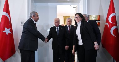 Peoples’ Equality and Democracy Party (DEM Party) lawmakers shake hands with Devlet Bahçeli (C), architect of the terror-free Türkiye initiative, Ankara, Türkiye, Jan. 2, 2025. (DHA Photo)