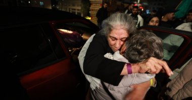 Palestinian leader of the Popular Front for the Liberation of Palestine (PFLP), Khalida Jarrar (C) greeted by relatives as she arrives in Ramallah, occupied West Bank, Jan. 20, 2025. (EPA Photo)