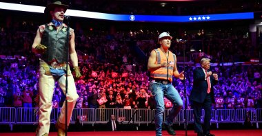 U.S. President-elect Donald Trump (R) dances as the Village People perform at a MAGA victory rally at Capital One Arena in Washington, D.C., U.S., Jan. 19, 2025. (AFP Photo)