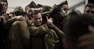 Israeli Defense Forces (IDF) soldiers cry during the funeral of a colleague, in west Jerusalem, Israel, Nov. 20, 2024. (AP Photo)