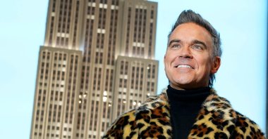 English singer-songwriter Robbie Williams stands on the Grand Staircase of the Empire State Building during a photo opportunity to celebrate the release of the musical biopic &quot;BETTER MAN,&quot; New York City, U.S., Jan. 14, 2025. (AFP Photo)