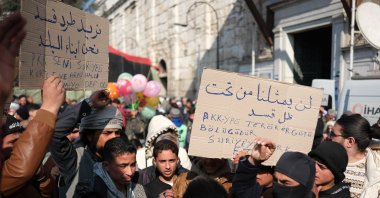 Syrians hold placards denouncing the PKK&#039;s Syrian wing YPG at a demonstration outside Umayyad Mosque, Damascus, Syria, Jan. 17, 2025. (AA Photo)