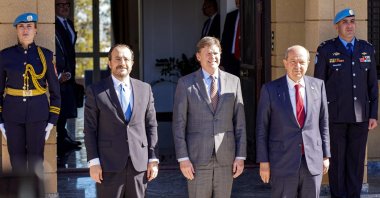 Colin Stewart (C), the U.N. Secretary-General&#039;s Special Representative in Cyprus, hosts Greek Cypriot leader Nicos Anastasiades (L) and Turkish-Cypriot leader Ersin Tatar (R) for a meeting to discuss the opening of new crossing points in the U.N. buffer zone dividing Cyprus&#039; capital Nicosia, Jan. 20, 2025. (AFP Photo)