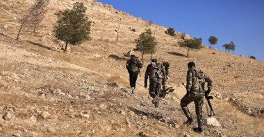 SNA members walk in an area where the army launched an operation against PKK/YPG near Tishrin Dam, Aleppo, Syria, Jan. 17, 2025. (AA Photo) 
