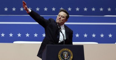 Elon Musk gestures at the podium inside the Capital One arena on the inauguration day of Donald Trump&#039;s second presidential term, Washington, U.S., Jan. 20, 2025. (Reuters Photo)