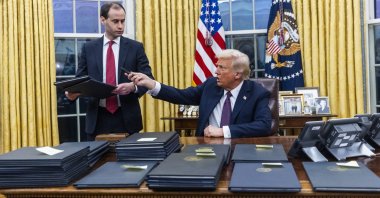 U.S. President Donald Trump signs numerous executive orders, on the first day of his presidency in the Oval Office of the White House in Washington, D.C., U.S., Jan. 20, 2025. (EPA Photo)