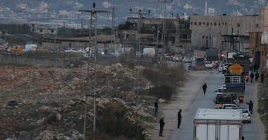Palestinians in their vehicles wait in line to cross the Israeli army checkpoint of Bet Forik at the entrance of Nablus, West Bank, Jan. 21, 2025. (EPA Photo)