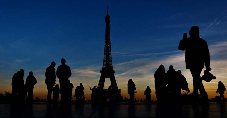 Tourists are silhouetted against the sunset as they take pictures on a cold day in Trocadero Square near the Eiffel Tower, Paris, France, Jan. 14, 2025. (Reuters Photo)