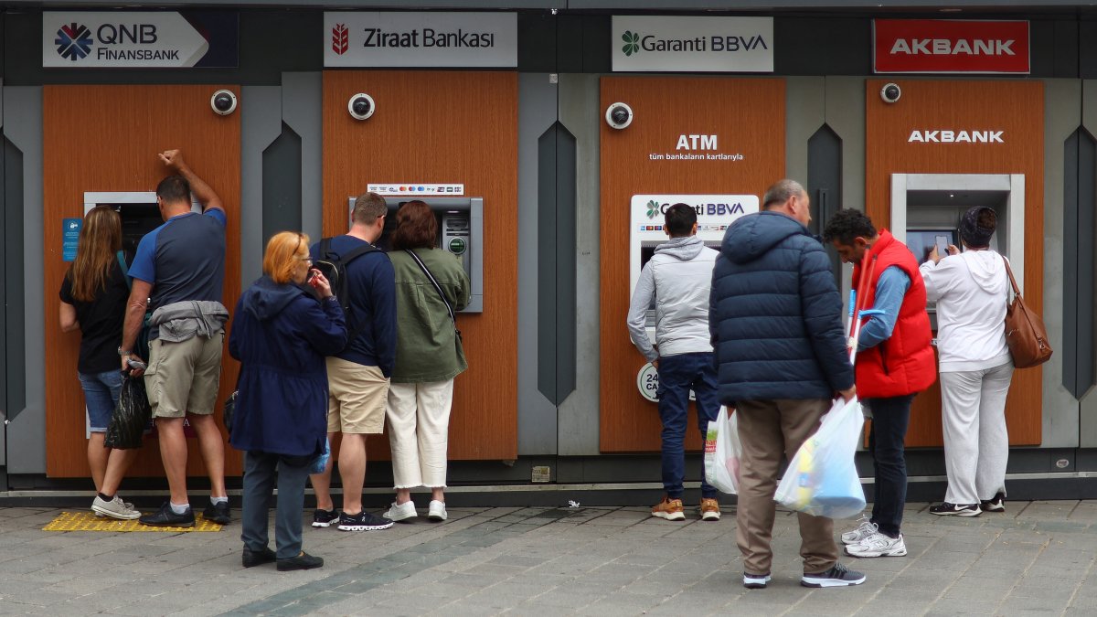 People use ATMs in Istanbul, Türkiye, May 29, 2023. (Reuters Photo)