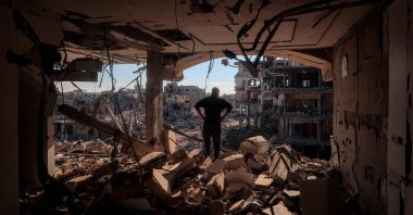 A man stands in a heavily damaged building without walls in Rafah, southern Gaza Strip, Palestine, Jan. 21, 2025. (AFP Photo)
