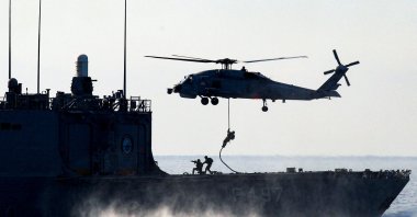 A Turkish naval ship and a helicopter take part in the Blue Homeland 2025 military exercise in the Aegean, off the shores of the coastal town of Marmaris, Türkiye, Jan. 9, 2025. (Reuters Photo)