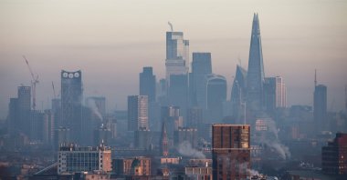 The buildings of the City of London financial district are seen on a cold and frosty morning from south London as the sun rises over the capital, U.K., Jan. 10, 2025. (AFP Photo)
