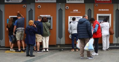 People use ATMs in Istanbul, Türkiye, May 29, 2023. (Reuters Photo)