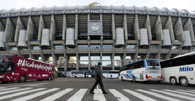 A man walks outside of the Santiago Bernabeu stadium, Madrid, Spain, Nov. 30, 2018. (AP Photo)