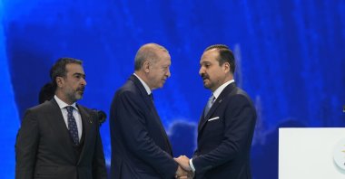 President Recep Tayyip Erdoğan shakes hands with Kürşad Zorlu who joined AK Party from IP, in the capital of Ankara, Türkiye, Jan. 21, 2025. (AA Photo)