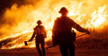Firefighters work as the Hughes Fire burns in Castaic, California, U.S., Jan. 22, 2025. (AFP Photo)