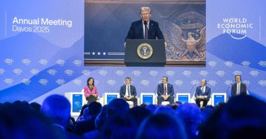 From left, Santander Bank executive chairperson Ana Botin, Bank of America CEO Brian Thomas Moynihan, French energy group TotalEnergies CEO Patrick Pouyanne, Blackstone CEO Stephen A. Schwarzman, World Economic Forum President and CEO Borge Brende attend a session as U.S. President Donald Trump is seen on a giant screen during his address by video conference at the World Economic Forum (WEF) annual meeting in Davos, Jan. 23, 2025. (AFP Photo)