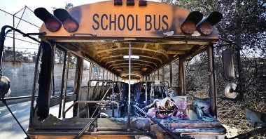 A burnt out school bus is seen at the fire-damaged Aveson Charter School from the aftermath of the Eaton Fire in Altadena, California, U.S., Jan. 13, 2025. (AFP Photo)