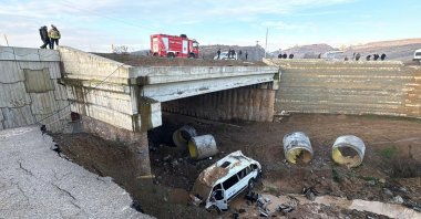 The shuttle bus that fell into a creek bed after the accident, Tuzla, Istanbul, Türkiye, Jan. 24, 2025. (AA Photo) 