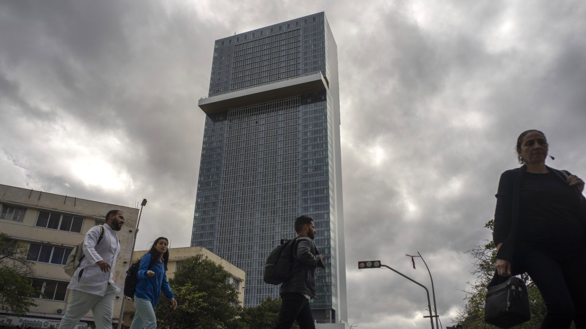People walk past the Selection La Habana new hotel, managed by Spanish chain Iberostar, in Havana, Cuba, Jan. 24, 2025. (AP Photo)