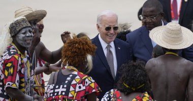 President Joe Biden watches a traditional dance after arriving at Catumbela airport, Angola, Dec. 4, 2024. (AP Photo)
